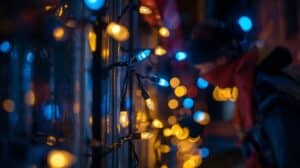 Blue and warm white lights trace a window frame.